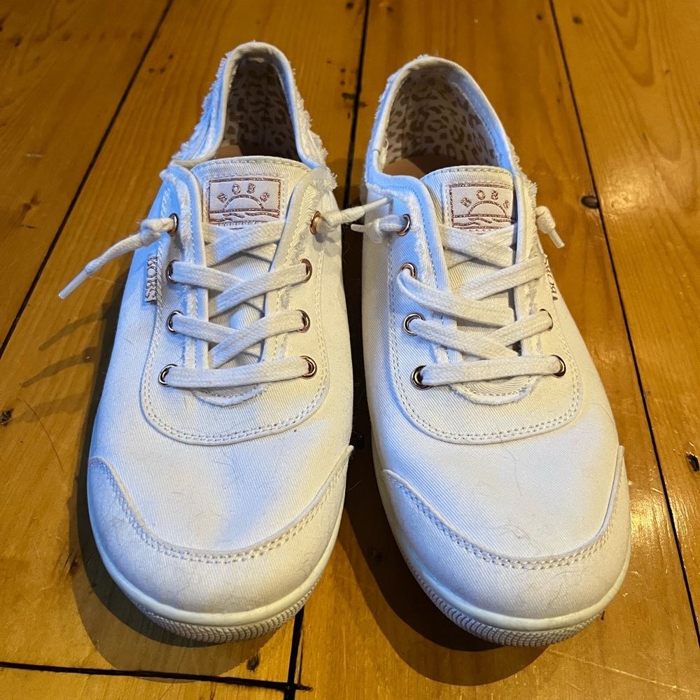 Comfortable white canvas sneakers.